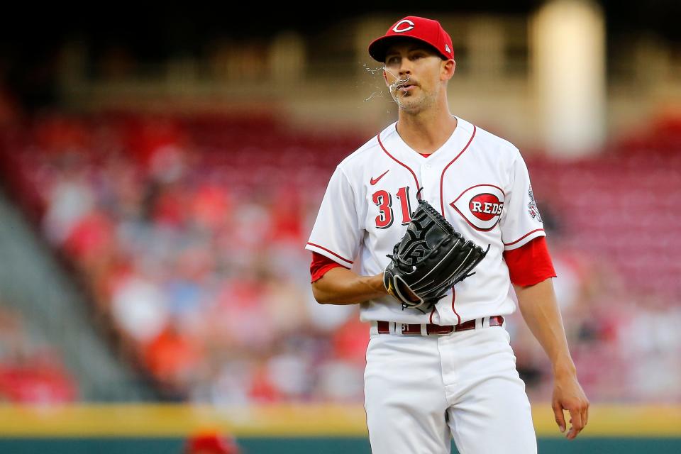 Cincinnati Reds starting pitcher Mike Minor (31) resets between pitches in the fifth inning of the MLB Interleague game between the Cincinnati Reds and the Baltimore Orioles at Great American Ball Park in downtown Cincinnati on Friday, July 29, 2022.