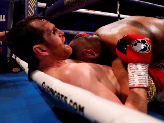 David Price reacts after Kash Ali bites him (Reuters)