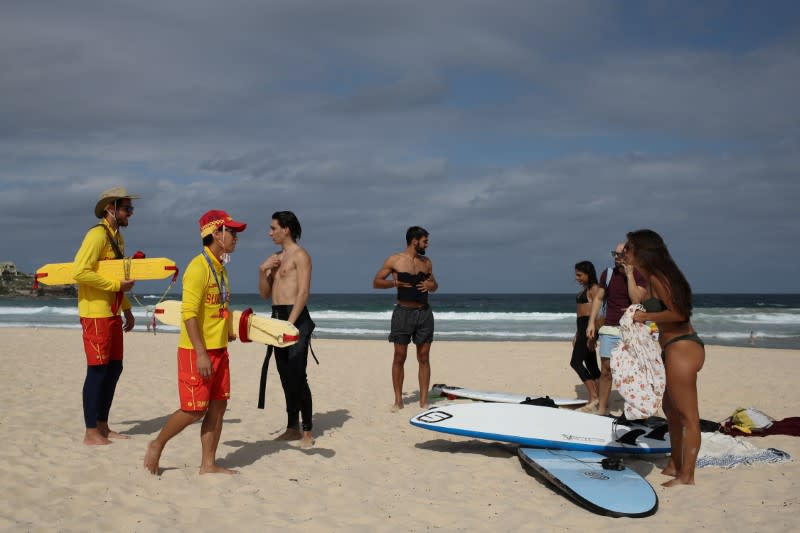 Surf rescue personnel enforce a closure of Bondi Beach to prevent the spread of the coronavirus disease (COVID-19) in Sydney