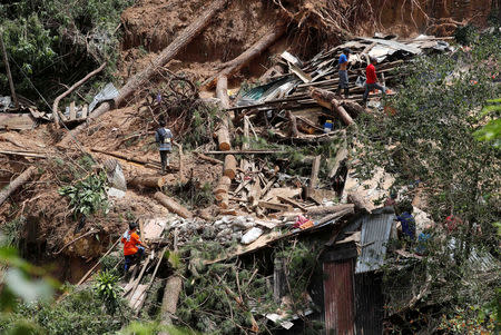 A view of debris and destroyed houses at the site of a landslide, after super typhoon Mangkhut hit the country, at a mining camp in Itogon, Benguet, Philippines September 17, 2018. REUTERS/Erik De Castro