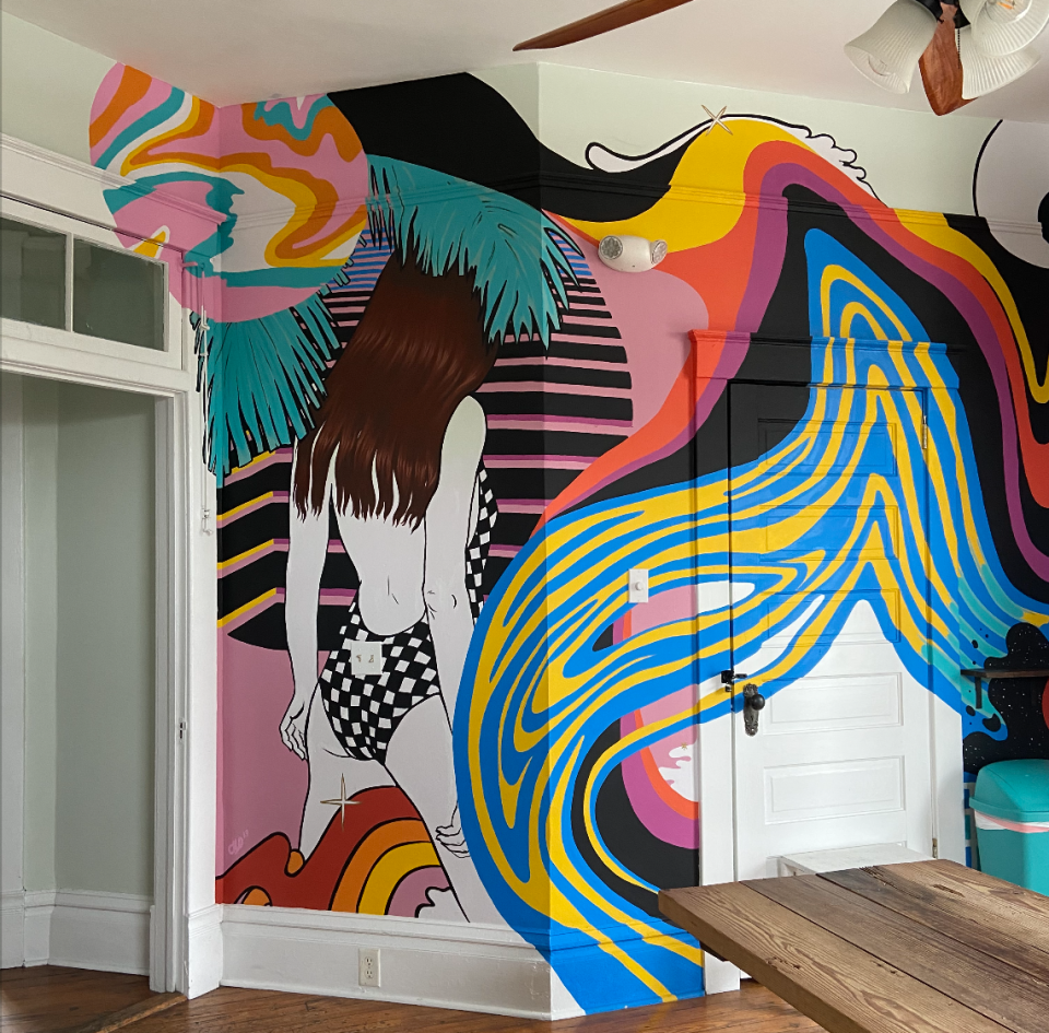 Alexandria Hall's murals often depict figures within a surrealistic scene. Hall is a muralist, painter and illustrator based in Nashville, Tennessee.