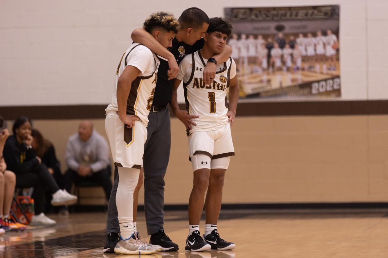 Austin's head boys basketball coach Rick Sapien talks to his players at a game against Harmony Science Academy Tuesday, Feb. 7, 2023, at Austin High School in El Paso, TX.