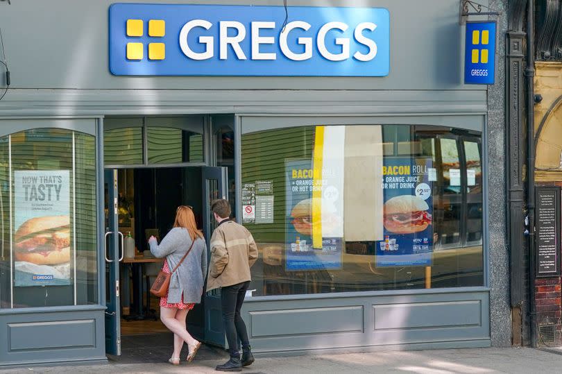 Customers enter a Greggs sandwich shop