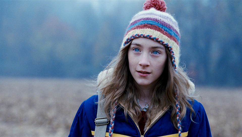 close up of a teen outside wearing a beanie