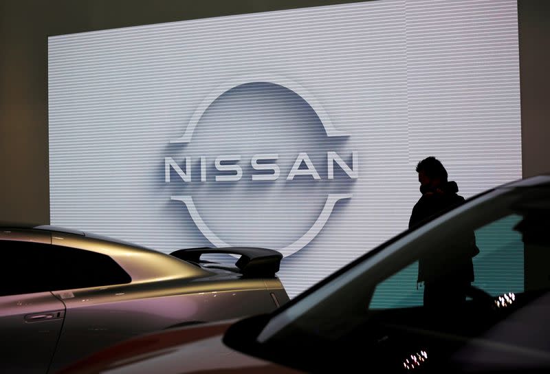FILE PHOTO: A visitor is seen at a Nissan Motor Corp. showroom in Tokyo, Japan