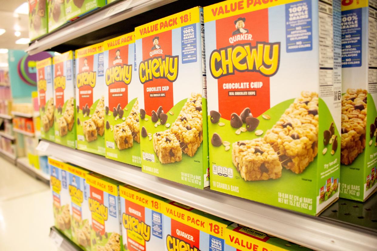 A view of several boxes of Chewy chocolate chip granola bars on display at a local grocery store.