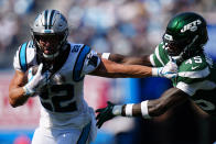 Carolina Panthers running back Christian McCaffrey pushes away New York Jets linebacker Hamsah Nasirildeen during the second half of an NFL football game Sunday, Sept. 12, 2021, in Charlotte, N.C. (AP Photo/Jacob Kupferman)