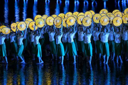 Performers give a performance during an evening gala. REUTERS/Stringer