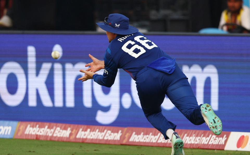 England's Joe Root takes a catch to dismiss Afghanistan's Rashid Khan off the bowling of Adil Rashid