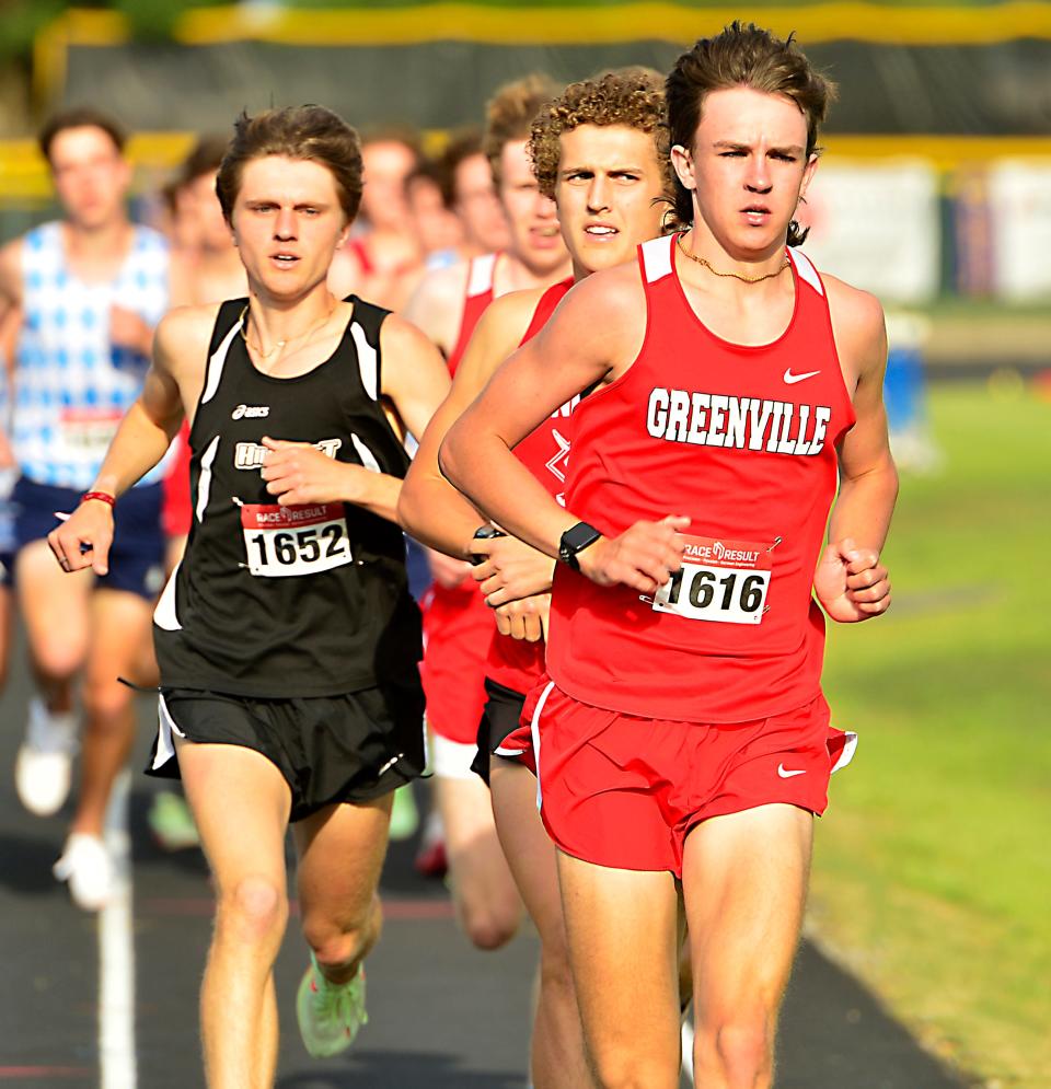 Greenville's Knox Young on his way to a win in the 1,600 at the Greenville County track championships in 2022.