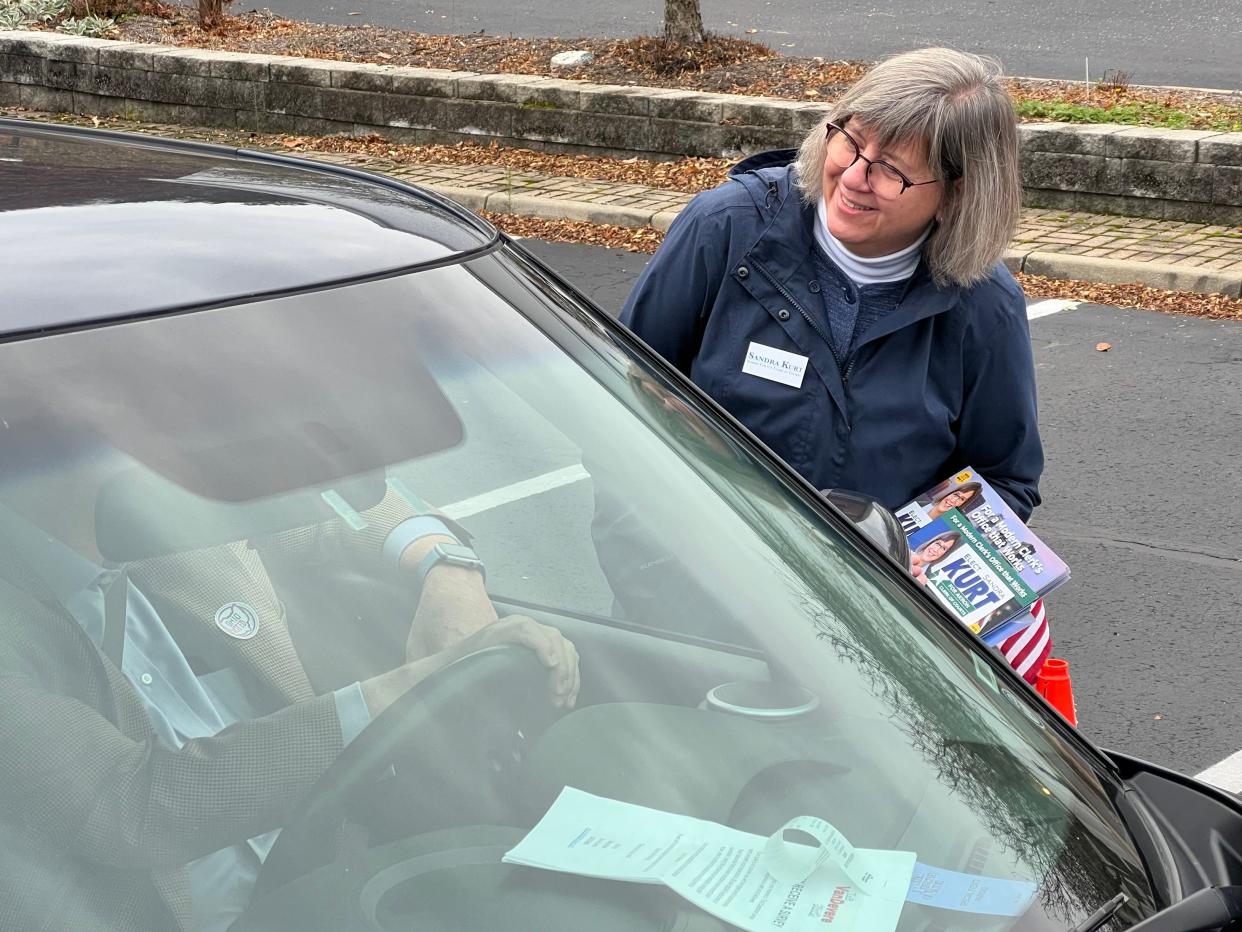 Summit County Clerk of Courts Sandra Kurt talks with a voter outside the Bath United Church of Christ polling place Nov. 7, 2023. Kurt is running for Akron Clerk of Courts.