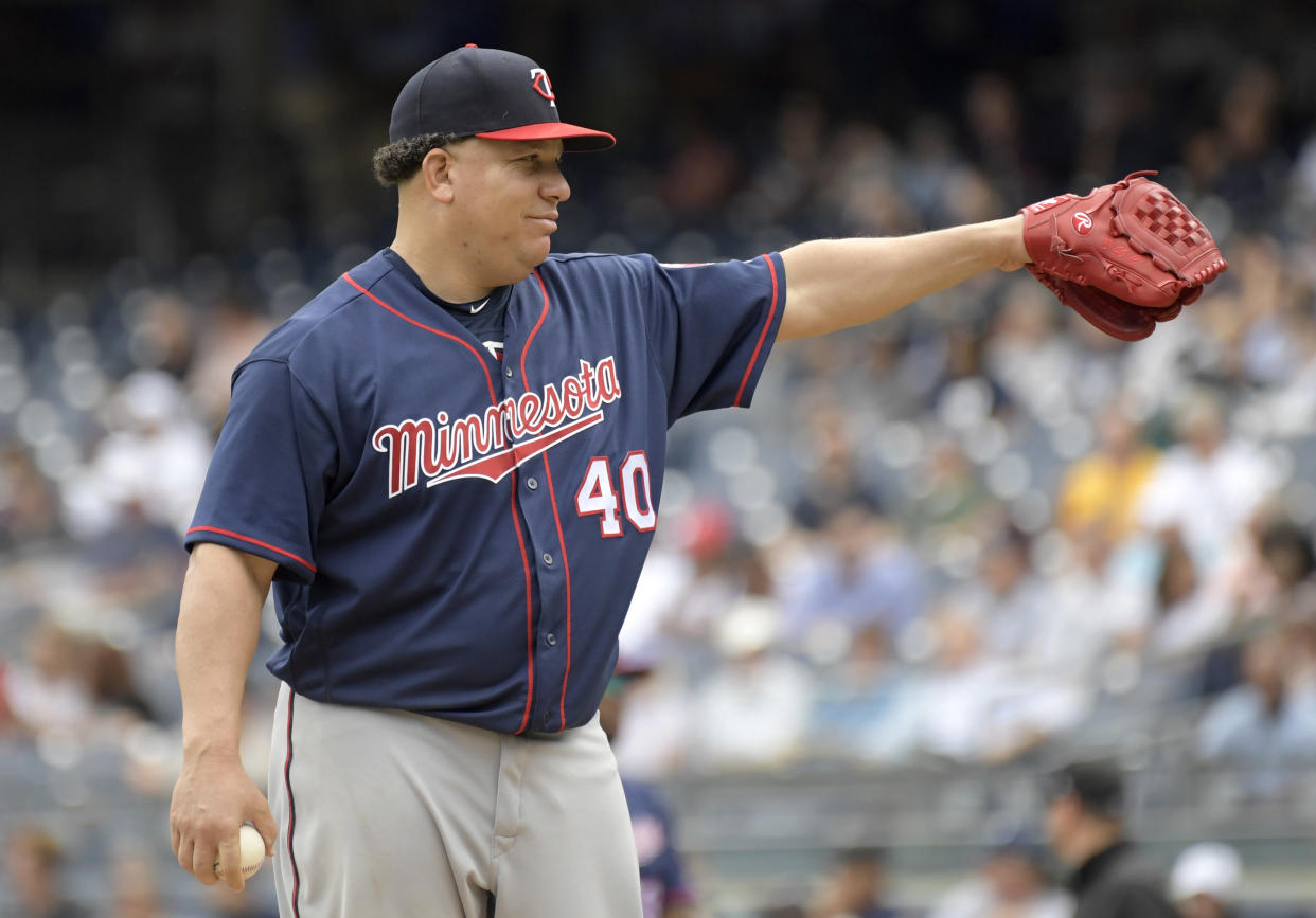 Bartolo Colon has obviously been practicing his pigeon-feeding technique for years. (AP Photo)