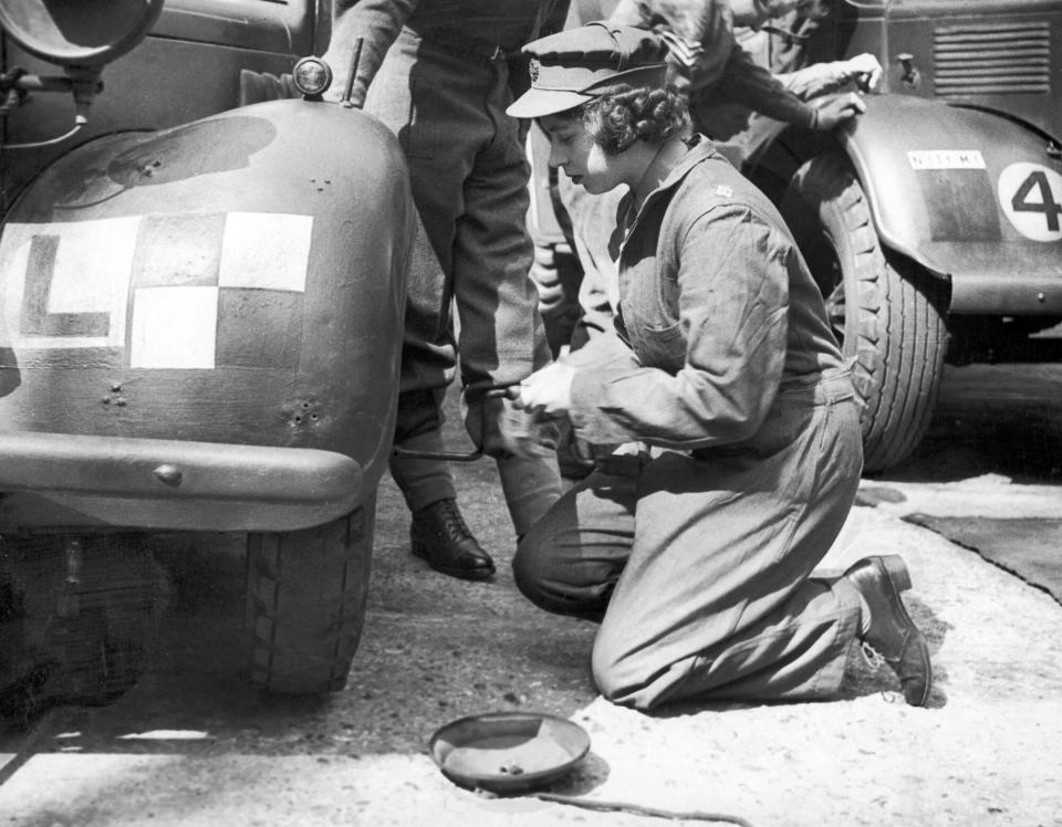 Princess Elizabeth learning basic car maintenance as a Second Subaltern in the A.T.S 12th April 1945.