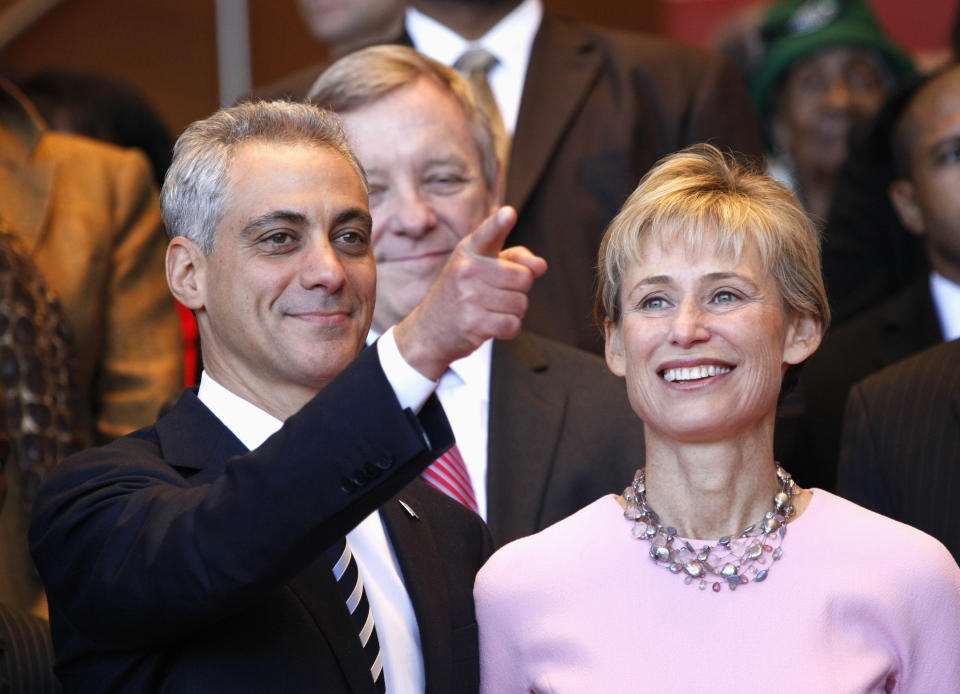 FILE - In this May 16, 2011, file photo, Chicago Mayor-elect Rahm Emanuel, left, and his wife, Amy Rule, look out into the crowd during his inaugural ceremony in Chicago. Emanuel, a Democratic congressman and chief of staff to President Barack Obama before becoming mayor in 2011, announced Tuesday, Sept. 4, 2018, that he won't seek a third term in 2019. (AP Photo/Charles Rex Arbogast, File)