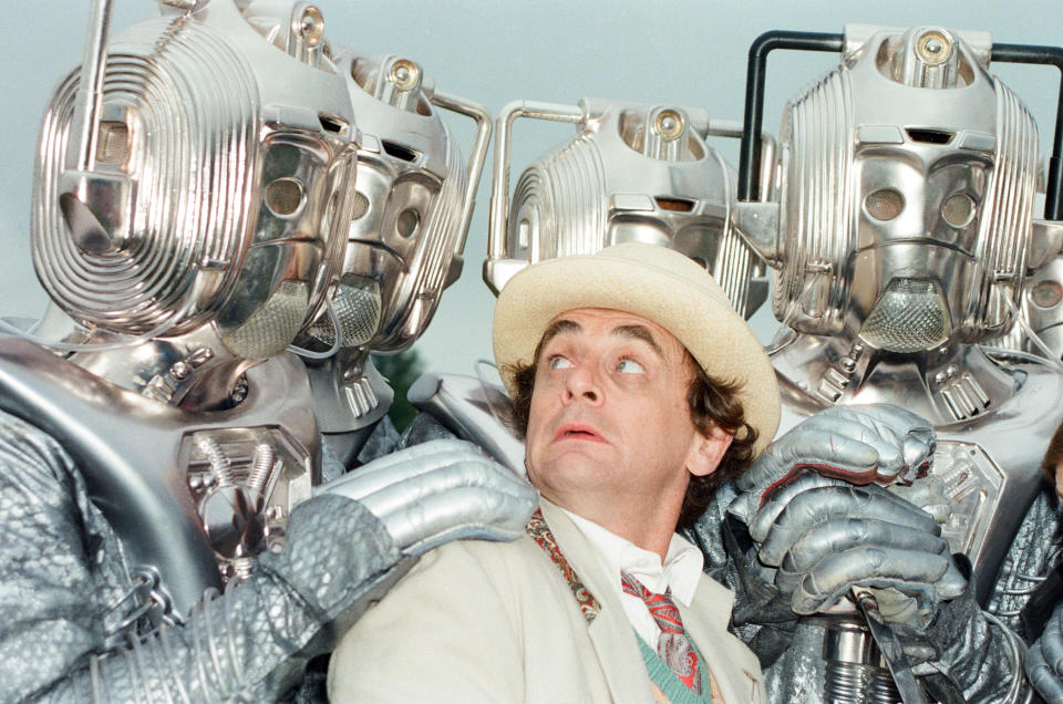 Sylvester McCoy as the Doctor seen here on location near Arundel with the Cybermen during the filming of the Dr Who story called The Silver Nemesis, 28th June 1988. (Photo by Arthur Sidey/Mirrorpix/Getty Images)