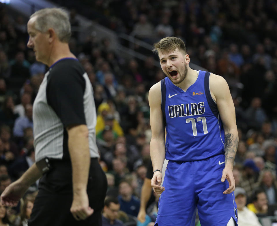 Dallas Mavericks' Luka Doncic reacts to a call during the second half of an NBA basketball game against the Milwaukee Bucks, Monday, Jan. 21, 2019, in Milwaukee. (AP Photo/Aaron Gash)