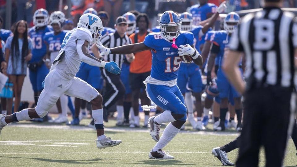 Savannah State wide receiver Diquan Brown eludes a tackler after catching a pass during the Tigers' 28-14 homecoming win.