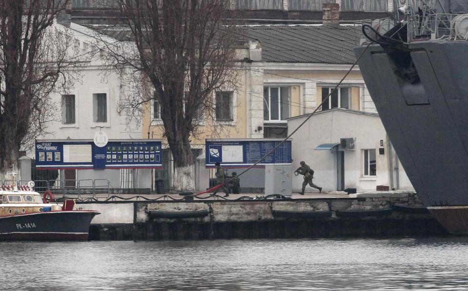 Russian servicemen are seen at a navy base in the Ukrainian Black Sea port of Sevastopol