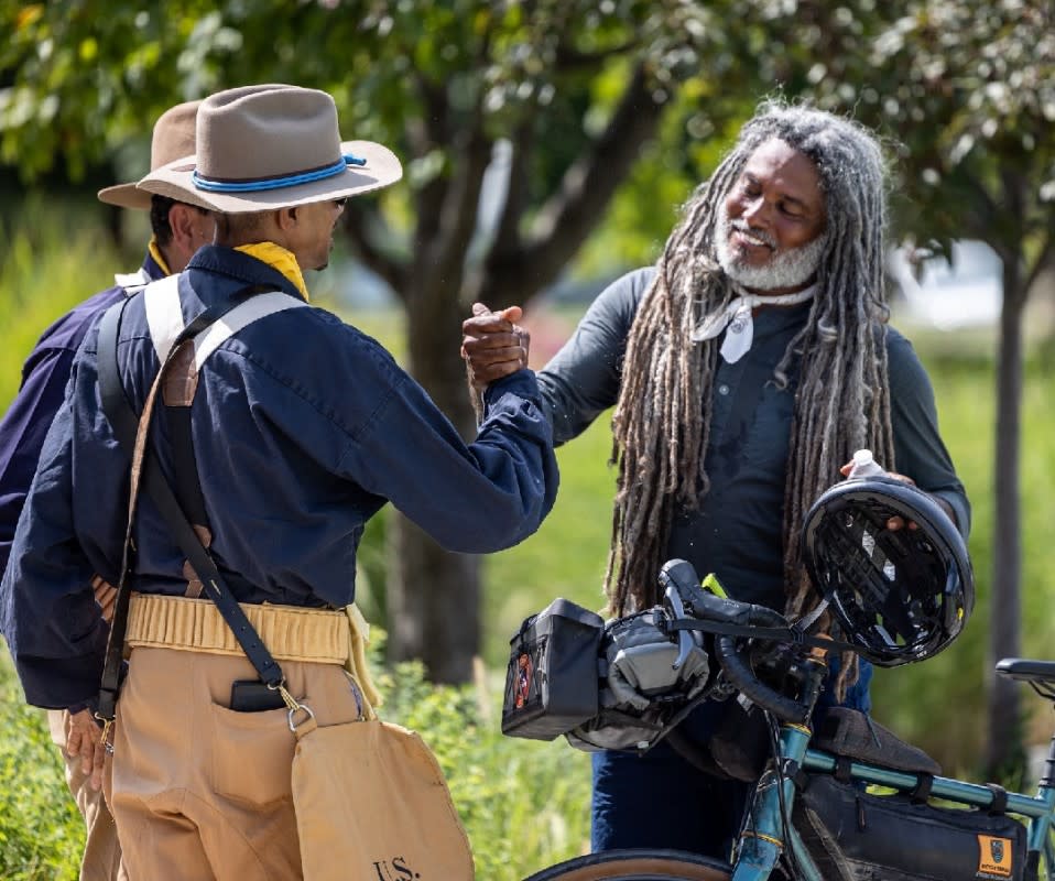 <em>Trading greetings and kudos with reenactors of the Buffalo Soldiers National Association (BSNA).</em><p>Josh Caffrey</p>