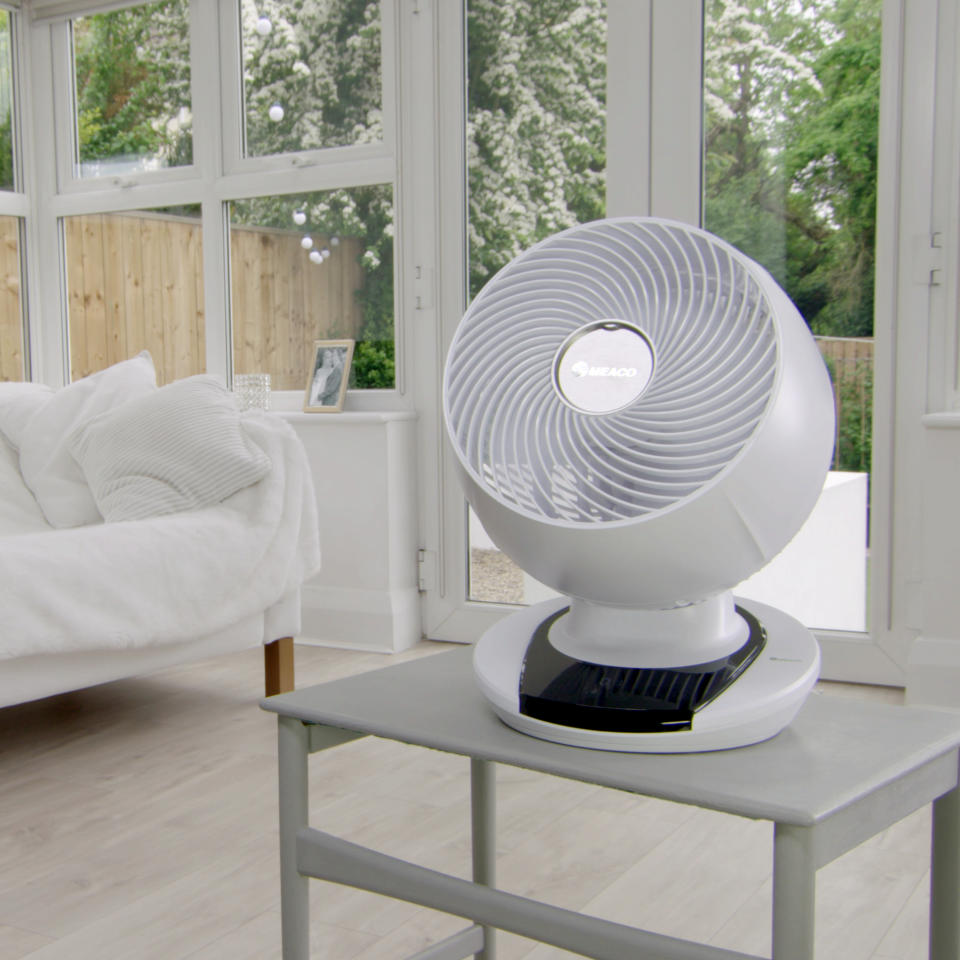 The MeacoFan 1056 Air Circulator sat on a chair in a white conservatory