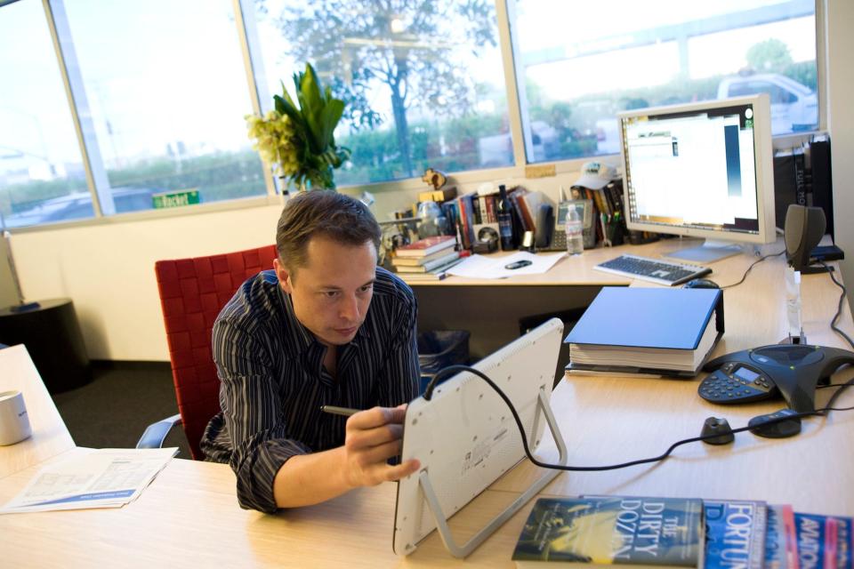 SpaceX and Tesla CEO Elon Musk works at his desk in 2008.