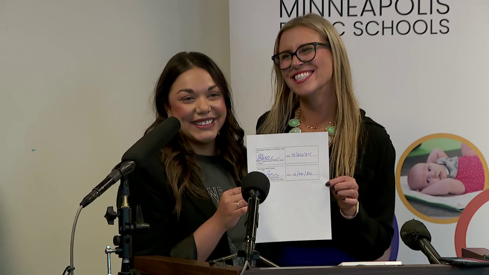 <div>District administrators and union teacher representatives celebrate a "historic agreement" between teachers and their district.</div> <strong>(FOX 9)</strong>