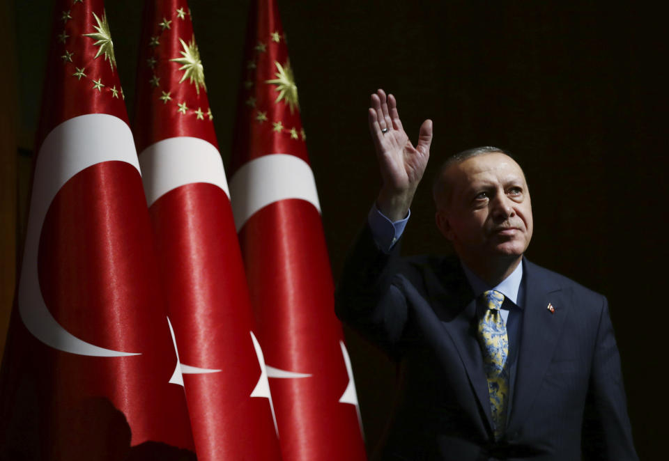 Turkey's President Recep Tayyip Erdogan waves to supporters as he arrives for a ceremony in Ankara, Turkey, Tuesday, Oct. 23, 2018. Saudi officials murdered Saudi writer Jamal Khashoggi in their Istanbul consulate after plotting his death for days, Erdogan said in a speech, contradicting Saudi Arabia's explanation that the writer was accidentally killed. He demanded that the kingdom reveal the identities of all involved, regardless of rank. (Presidential Press Service via AP, Pool)