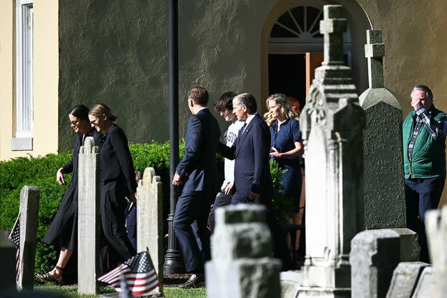 <p>Mandel Ngan/AFP/Getty</p> President Biden's son and grandchildren attend a private service honoring Beau Biden. Beau's son, 18-year-old Robert "Hunter" Biden, is pictured in the center wearing a light gray sweater