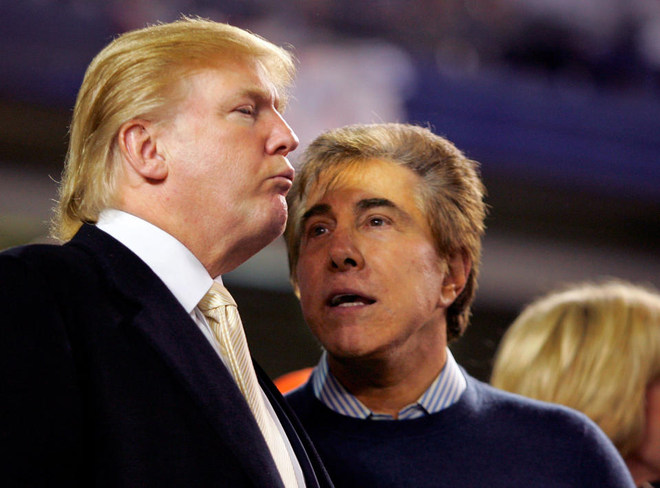 FILE PHOTO: Donald Trump (L) and Steve Wynn talk before the start of Game 7 of the NLCS playoff baseball series in New York in this October 19, 2006 file photograph. REUTERS/Andrew Gombert/File Photo