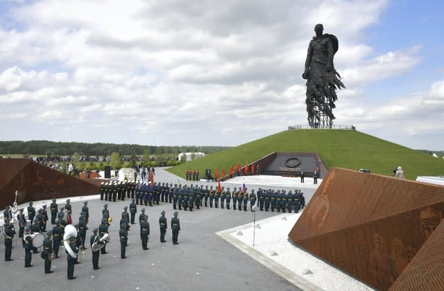 Russian President Vladimir Putin, background second right, and Belarus President Alexander Lukashenko, right, attend an opening ceremony of the monument (Andrei Stasevich/AP)