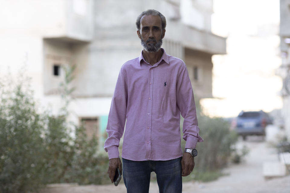 Mohsen al-Sheikh, 52, stands in his neighborhood of the city of Derna, Libya, on Monday, Sept. 9, 2024 which was covered in floodwaters a year ago after two dams burst upstream. (AP Photo/Muhammad Elalwany)