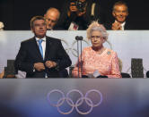 FILE - In this July 28, 2012, file photo, Britain's Queen Elizabeth II, right, declares the games open alongside International Olympic Committee Vice President Thomas Bach during the Opening Ceremony at the 2012 Summer Olympics in London. (AP Photo/Cameron Spencer, Pool, File)