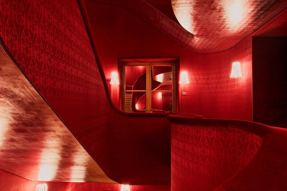 Ornate red interior of a concert hall lobby in Switzerland