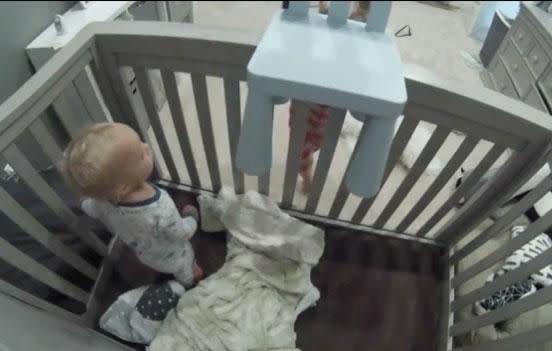 The brother dumps the chair in the cot to help his little brother escape. Source: Daily Bumps / Facebook