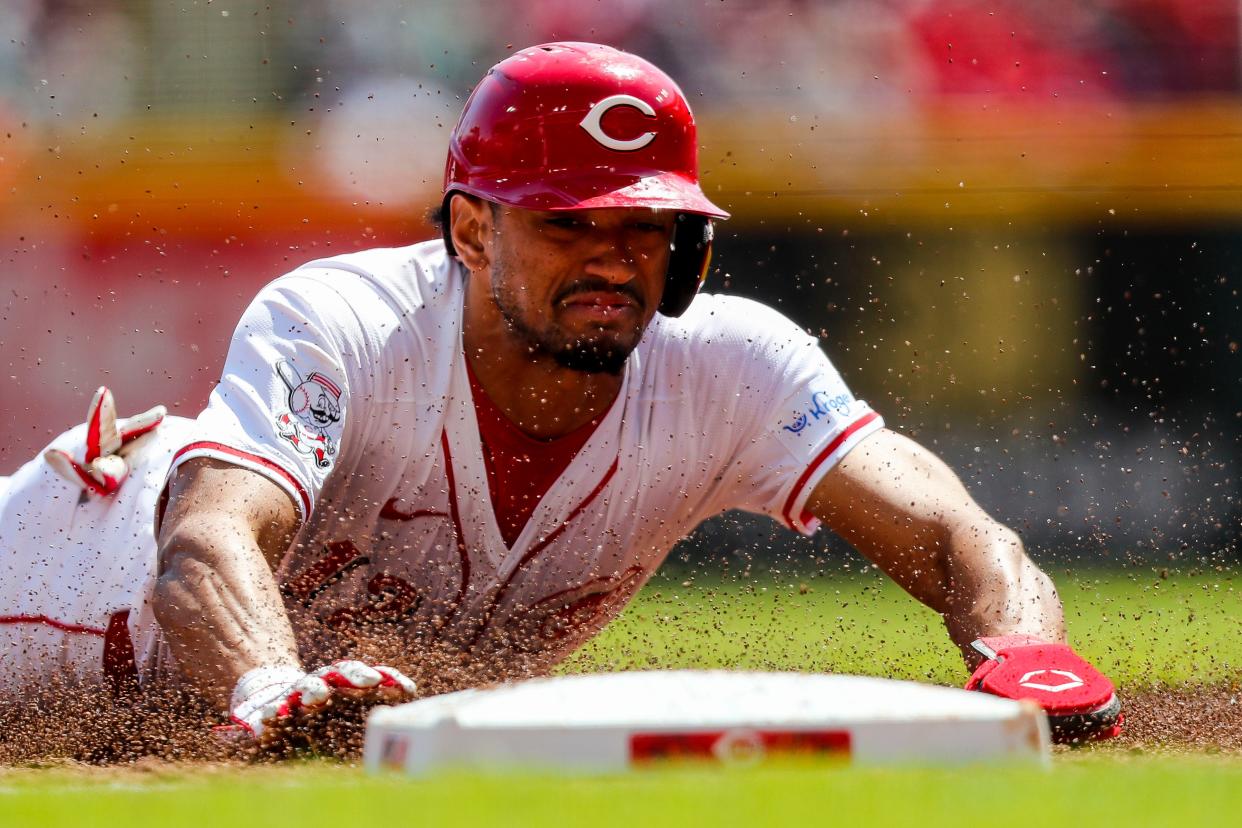 Bubba Thompson steals third base during the Reds' last homestand.