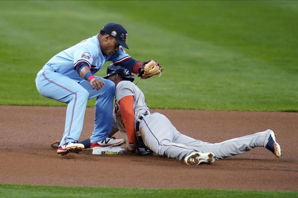 Detroit Tigers' Victor Reyes beats the tag attempt by Minnesota Twins shortstop Jorge Polanco to steal second base during the first inning of a baseball game Wednesday, Sept. 23, 2020, in Minneapolis. (AP Photo/Jim Mone)