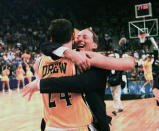 FILE - In this March 13, 1998, file photo, Valparaiso's head coach Homer Drew hugs his son, Bryce Drew, after Bryce hit a game-winning three-point shot at the buzzer to beat Mississippi 70-69 in the first round of the NCAA Midwest Regional college basketball game in Oklahoma City. (AP Photo/John Gaps III, File)