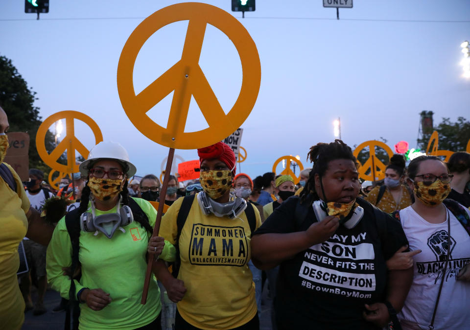 Mothers protest against racial inequality and police violence in Portland, Oregon, U.S., July 22, 2020. REUTERS/Caitlin Ochs