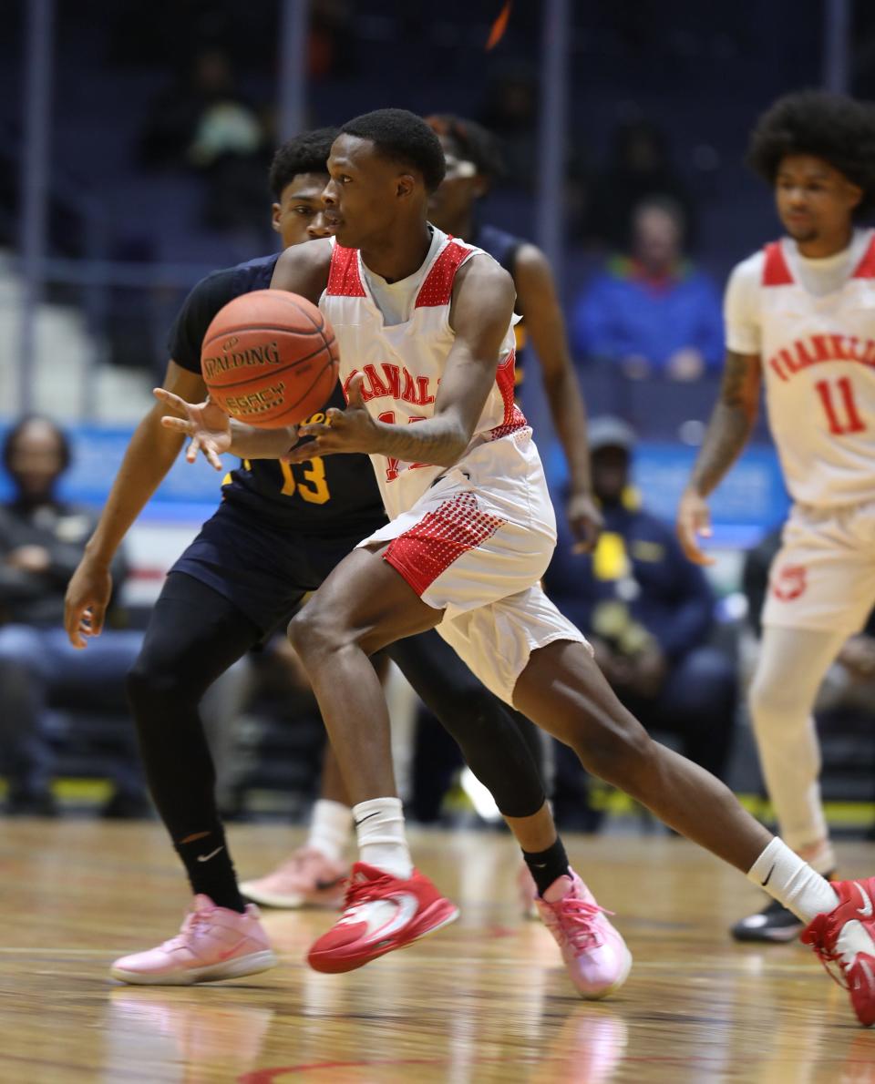 Franklin's Clarence Thompson drives by UPrep's Jermelle Cotton.