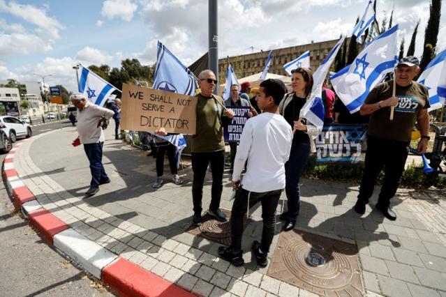 Members of the 'Brothers in Arms' reservist protest group demonstrate, as Israeli Prime Minister Benjamin Netanyahu's nationalist coalition government presses on with its judicial overhaul, in Kiryat Ono