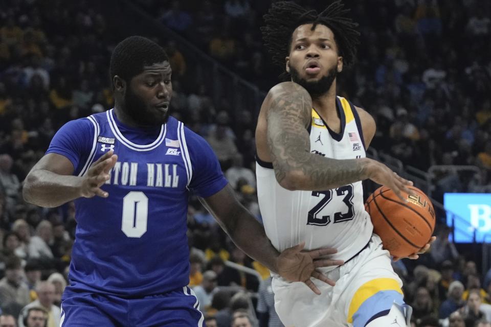 Marquette's David Joplin gets past Seton Hall's Dylan Addae-Wusu during the first half of an NCAA college basketball game Saturday, Jan. 27, 2024, in Milwaukee. (AP Photo/Morry Gash)