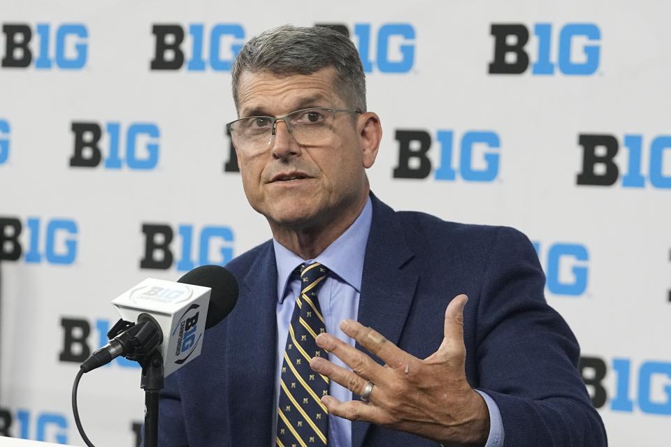 Michigan head coach Jim Harbaugh speaks during an NCAA college football news conference at the Big Ten Conference media days at Lucas Oil Stadium, Thursday, July 27, 2023, in Indianapolis. (AP Photo/Darron Cummings)