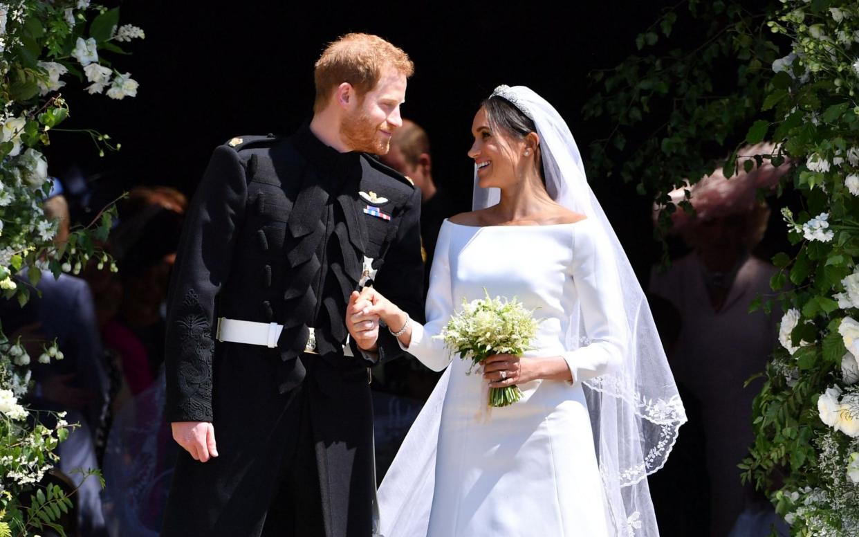 The Duke and Duchess of Sussex on their wedding day - AFP