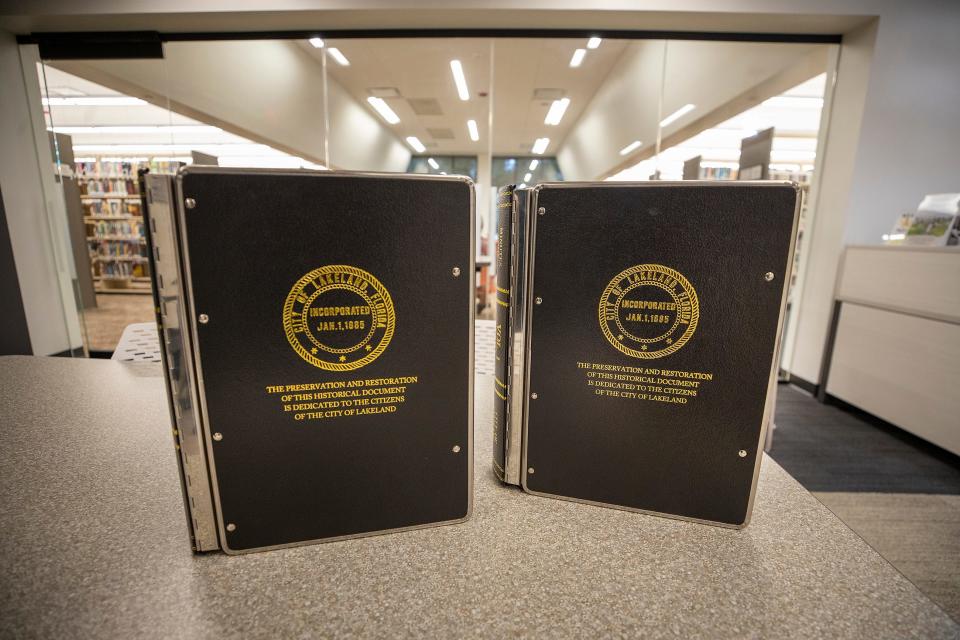 Restored ledgers of Lakeland's earliest city council minutes in the Lakeland History and Culture Center. The pages, once crumbling, are now restored in Mylar sheets encased in metallic books.