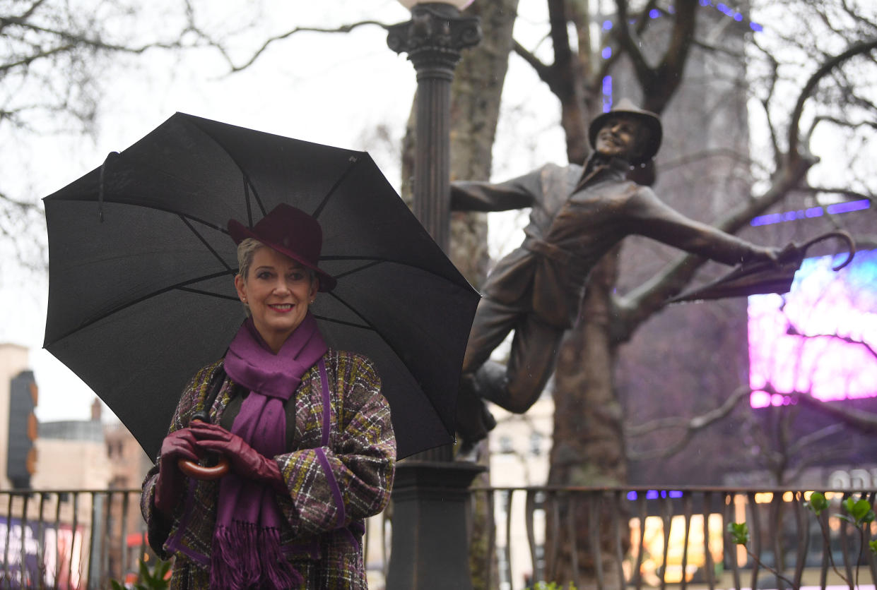 Patricia Ward, widow of Gene Kelly, alongside a statue of the Hollywood legend as she attends the Scenes In The Square statue trail unveiling in Leicester Square, London. (Photo by Victoria Jones/PA Images via Getty Images)