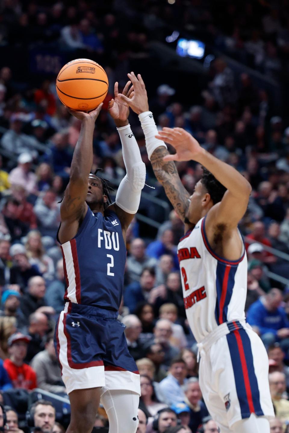 Mar 19, 2023; Columbus, OH, USA; Fairleigh Dickinson Knights guard Demetre Roberts (2) shoots the ball over Florida Atlantic Owls guard Nicholas Boyd (2) in the first half  at Nationwide Arena. Mandatory Credit: Rick Osentoski-USA TODAY Sports