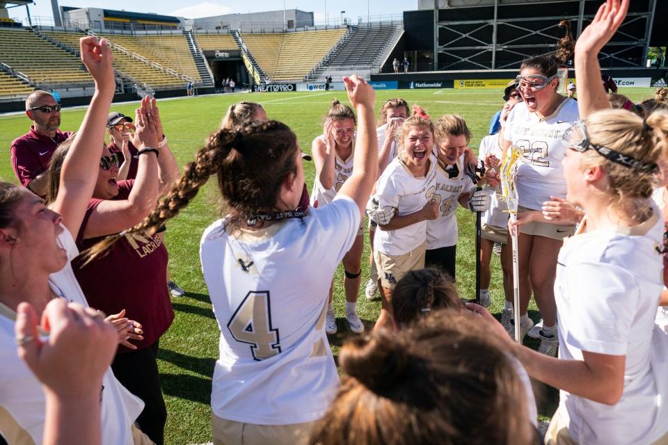 New Albany celebrates after beating Upper Arlington 13-12 in overtime to capture the Division I state title June 4 at Historic Crew Stadium. The Eagles won their first state championship since 2013, first in Division I and fifth overall.