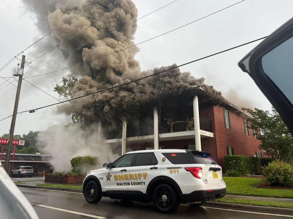 Part of Highway 90 was shut down Thursday afternoon while firefighters battled a blaze at Adkinson Law Firm in DeFuniak Springs.