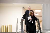 U.S. Senate Majority Leader Mitch McConnell (R-KY) descends down an escalator ahead of a series of votes on response for the coronavirus disease (COVID-19), on Capitol Hill in Washington