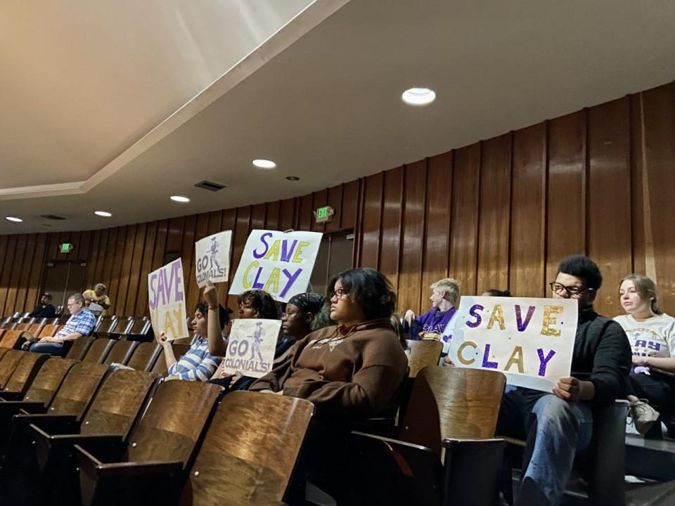 Clay High School students cheer on speakers from the back of the auditorium during a public hearing Wednesday, April 12, 2023, at Jackson Middle School.